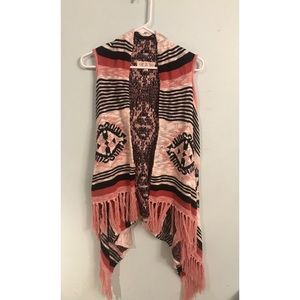 Pink, cream, and black sleeveless sweater